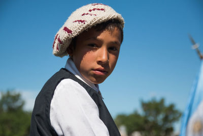 Young boy wearing argentinian traditional clothes