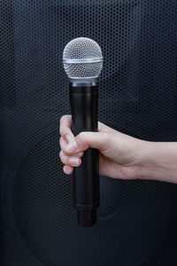 Close-up of hand holding camera