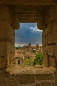 Buildings seen through arch window