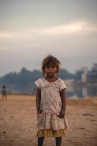 Portrait of girl standing on land