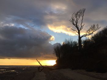 Scenic view of landscape against cloudy sky