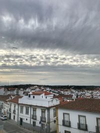 High angle view of townscape against cloudy sky