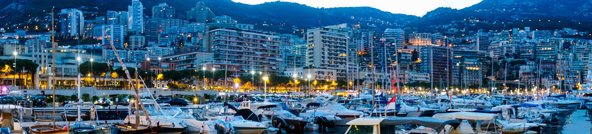 Panoramic view of illuminated buildings in city at night