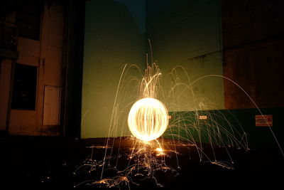 Close-up of illuminated lighting equipment at night