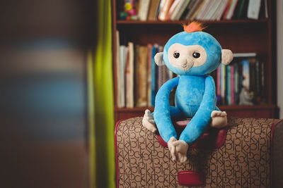 Close-up of stuffed toy on chair