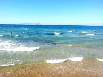 Scenic view of sea against clear blue sky
