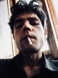 Portrait of man smoking cigarette