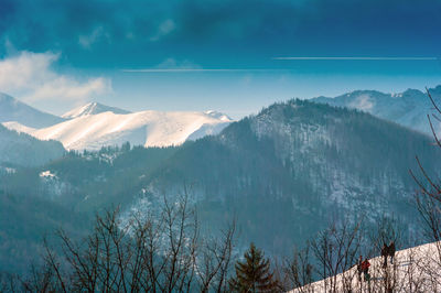 Scenic view of snowcapped mountains against sky