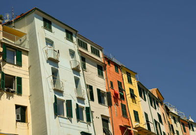 Low angle view of building against clear blue sky