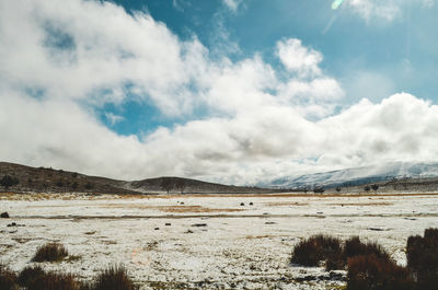 Scenic view of snowcapped mountains against sky