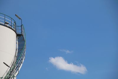 Low angle view of steps against blue sky