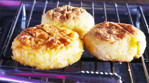 High angle view of bread on barbecue grill