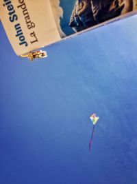 Low angle view of paper against the sky