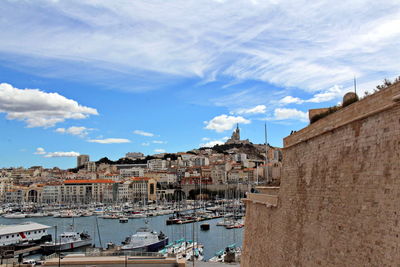 Marseille. vieux port and bonne mere church against blue sky