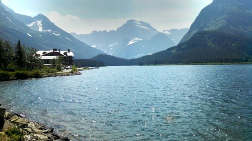 Scenic view of lake and mountains against sky