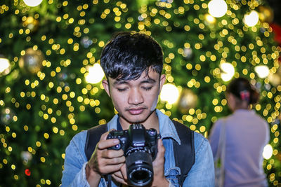 Portrait of man photographing