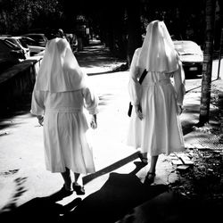 Nun walking in street