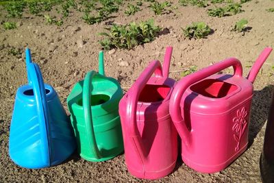 Close-up of various toys on beach