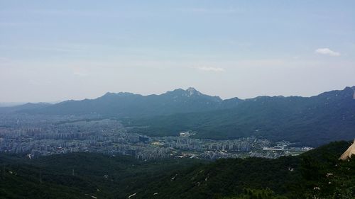 Scenic view of cityscape against sky