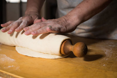 Close-up of person preparing food on table