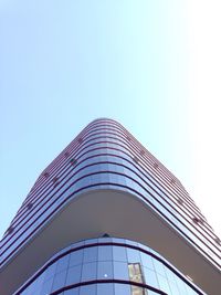 Low angle view of skyscraper against clear sky