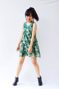 Portrait of a smiling young woman over white background