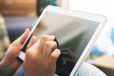 Close-up of woman using mobile phone