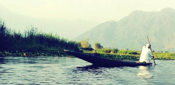 Scenic view of lake with mountains in background