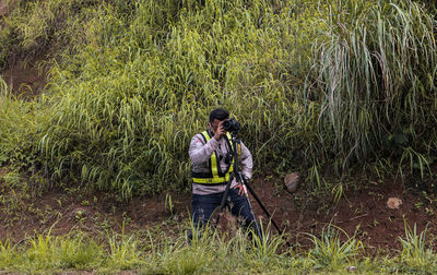 Full length of man standing on grass