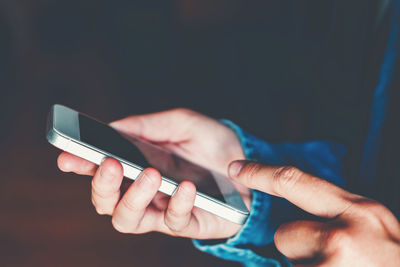 Close-up of person using mobile phone