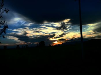 Silhouette of building against sky at sunset