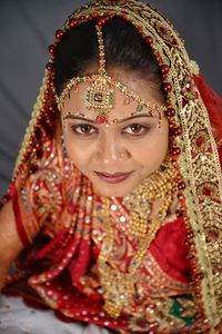 Portrait of beautiful young bride at home