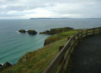 Scenic view of sea against cloudy sky