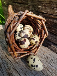 Quail eggs into cornucopia basket