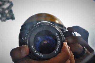 Close-up of hand holding camera