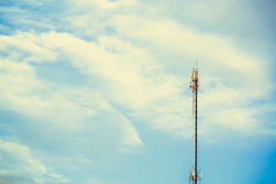 Low angle view of communications tower against sky