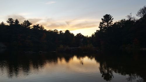 Scenic view of lake at sunset