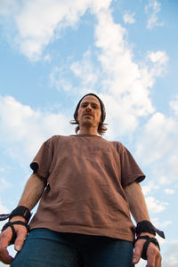 Low angle portrait of young man wearing sports protection