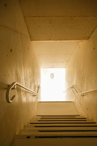 Low angle view of illuminated staircase in building