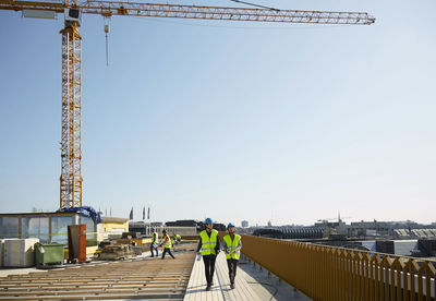 Rear view of construction site against clear sky
