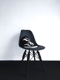 Empty chair against white background