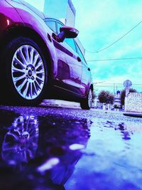 Reflection of clouds in puddle