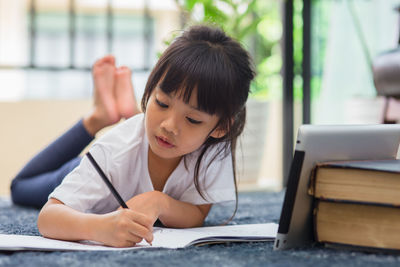 Boy sitting on table