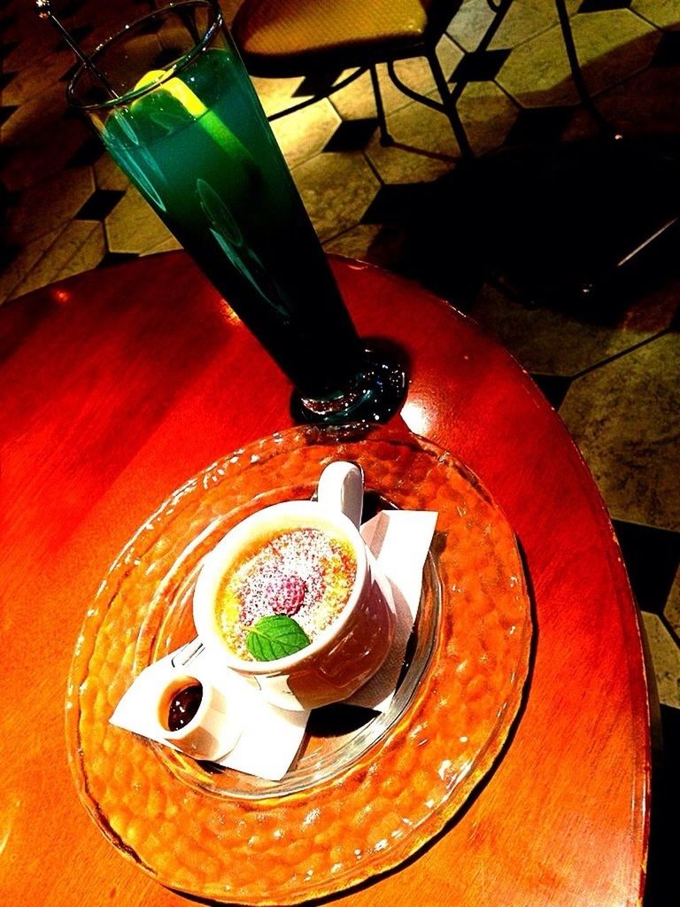 indoors, food and drink, table, still life, high angle view, freshness, drink, spoon, food, plate, close-up, refreshment, coffee cup, directly above, healthy eating, no people, saucer, wood - material, cup, bowl