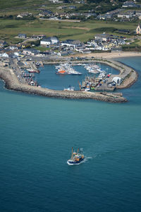 High angle view of boats in city