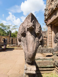 Statue of historic building against sky