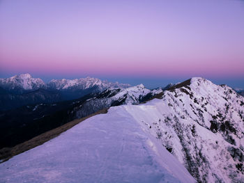 Scenic view of snowcapped mountains against sky during winter