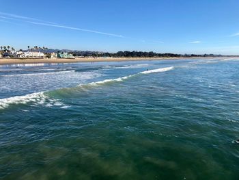 Scenic view of sea against blue sky