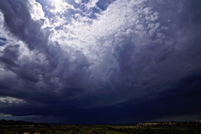 Scenic view of dramatic sky over land