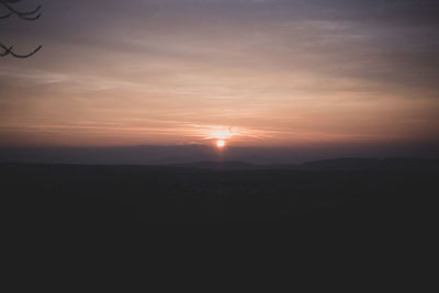 Scenic view of silhouette landscape against sky during sunset